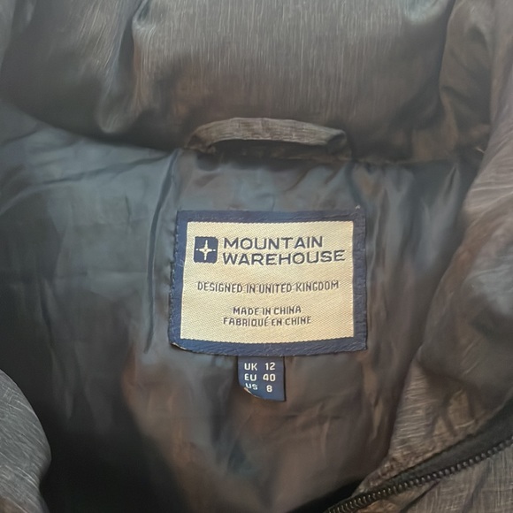 Gray puffy vest very warm. It was in the closet for a while. Never been used. - Picture 2 of 4